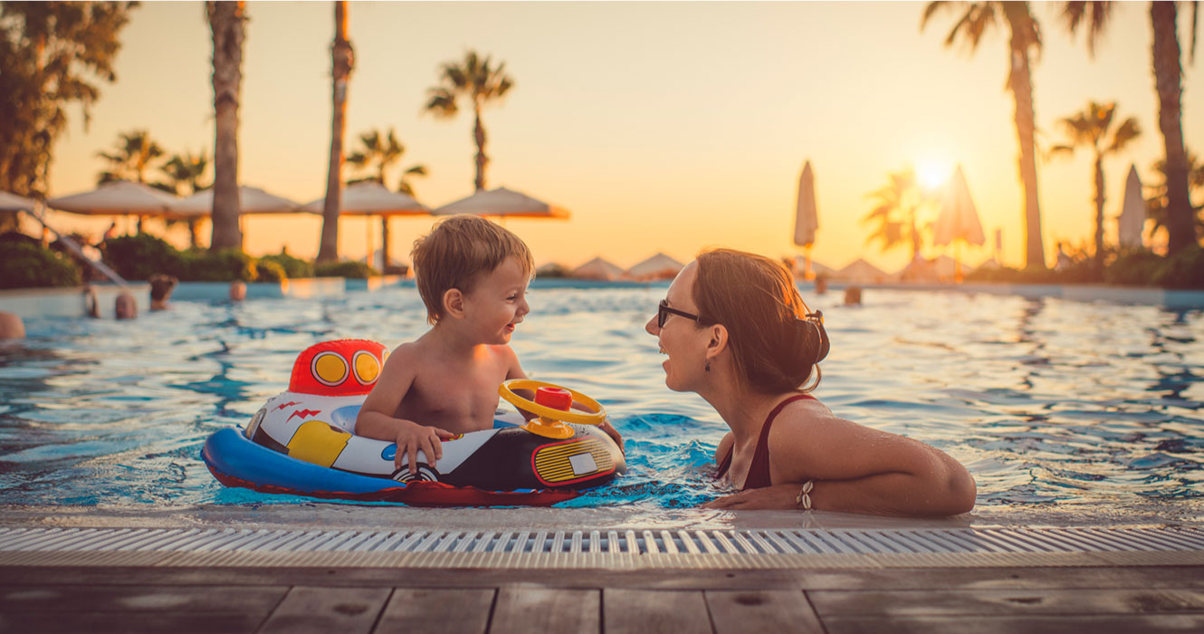 Mom and son playing in pool