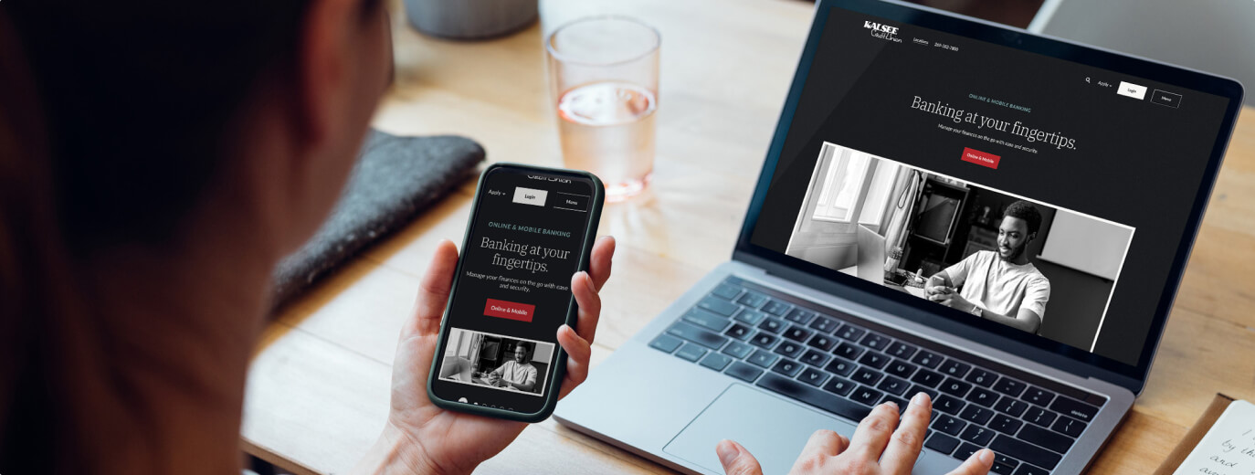 Person viewing new website on mobile and laptop