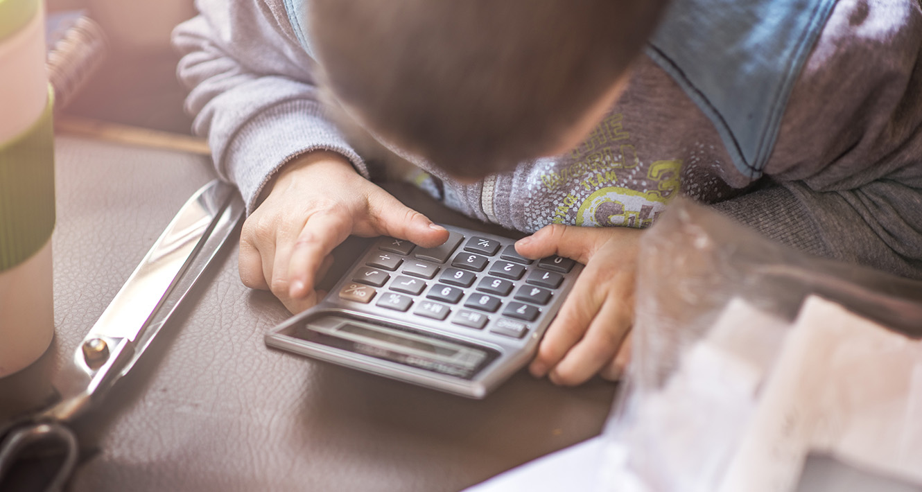 Kid using a calculator