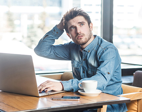 man scratching his head